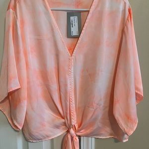 Adrienne top size small. Brand new tags still attached. Peach color